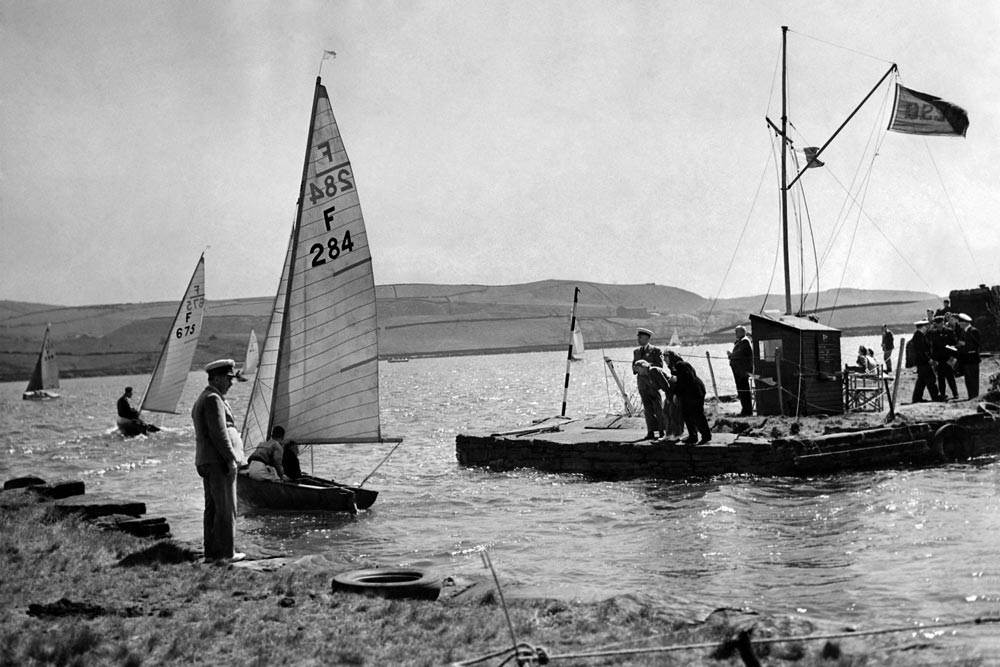 Firefly dinghy racing at Hollingsworth Lake. F. 284 passes the signal station on her way to the start. May 1950