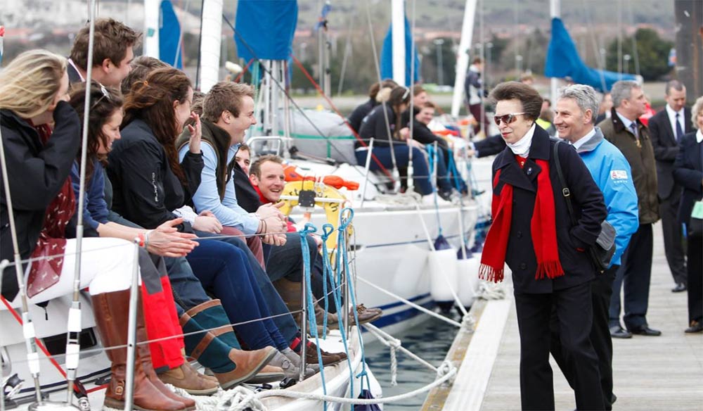 Princess Anne talking to people on a boat