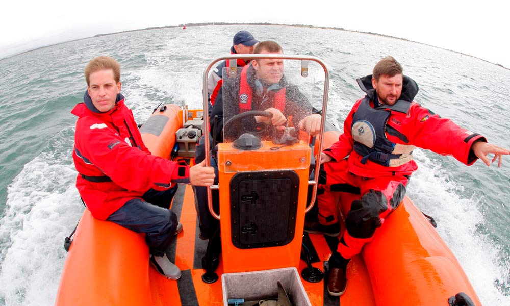 Instructor on a rib with students 