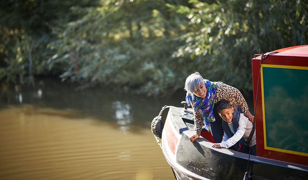 wide shot of mother and son on a sailing holiday