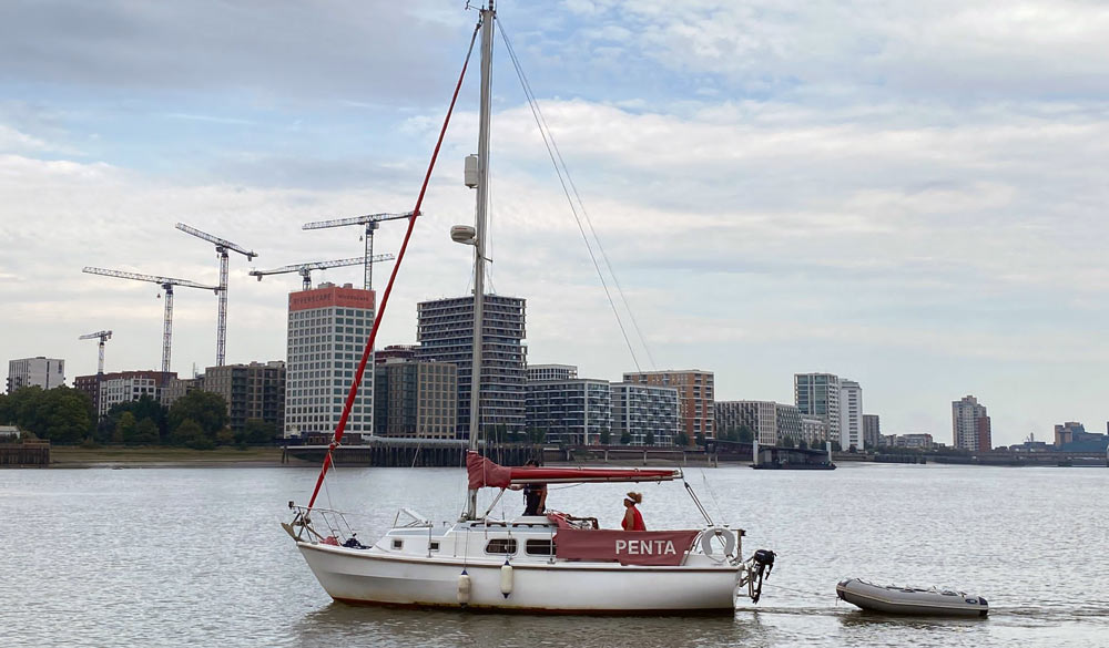 wide shot of Tinu at the helm 