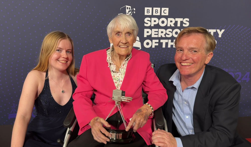 posed shot of Jean next to a man and woman after receiving an awards at the BBC sports personality of the year