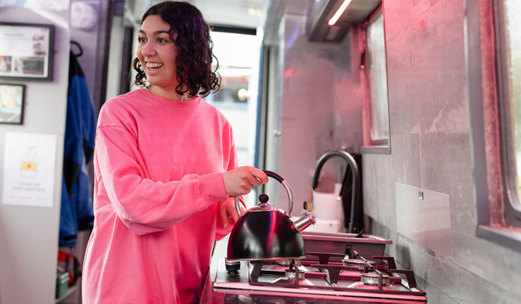 Lady cooking on a boat 