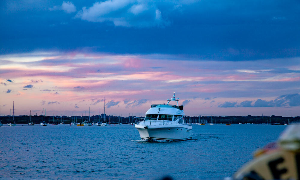 sailing along sunset sky