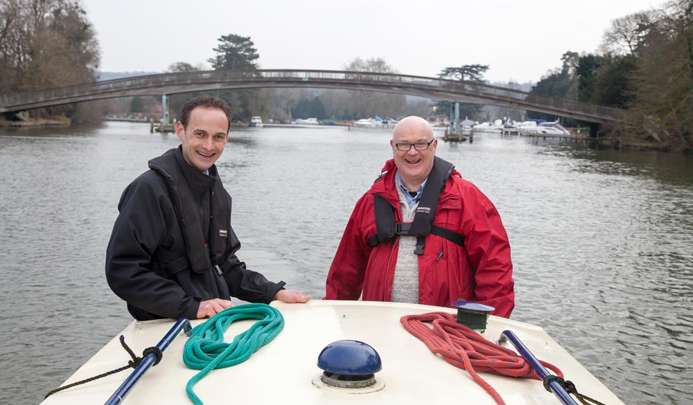 wide shot of men on inland waterway